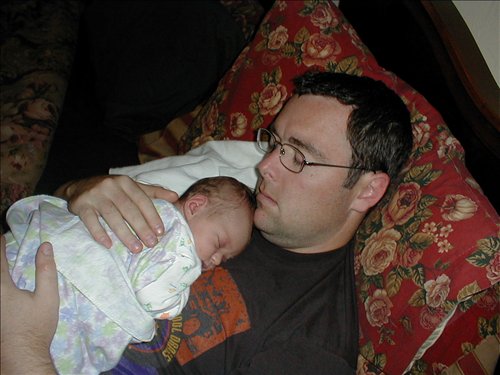 Valerie and Dad catching a snooze. P1010043.JPG. Uploaded by Jeanella & Stacy Clark on 4/28/2004. 