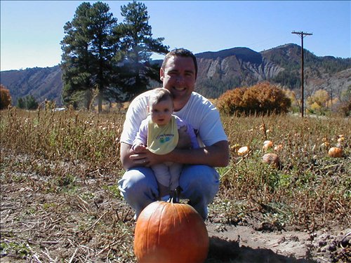 Valerie's first pumpkin. P1010118.JPG. Uploaded by Jeanella & Stacy Clark on 10/11/2004. 