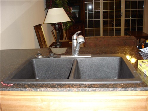 Sink, black, stone like finish - garbage disposal on left. DSC02716.jpg. Uploaded by Marie Hoffmann on 1/13/2007. 