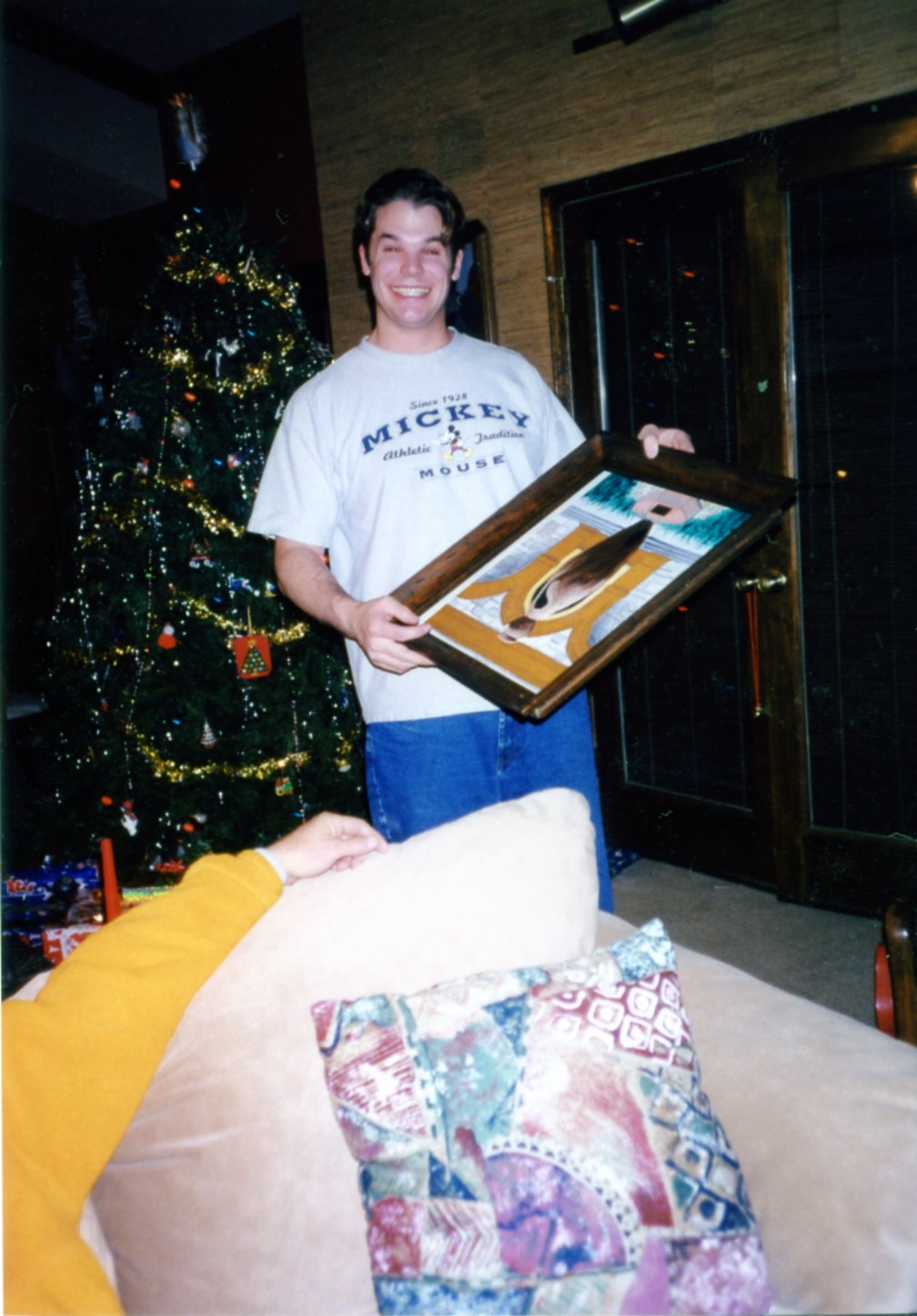 Chuck with oil painting he made and gave to Erik. 1998-12-25 (5) Chuck Hoffmann 7808 NW Hampton Rd KCMO.jpg. Uploaded by Marie Hoffmann on 4/18/2026. 